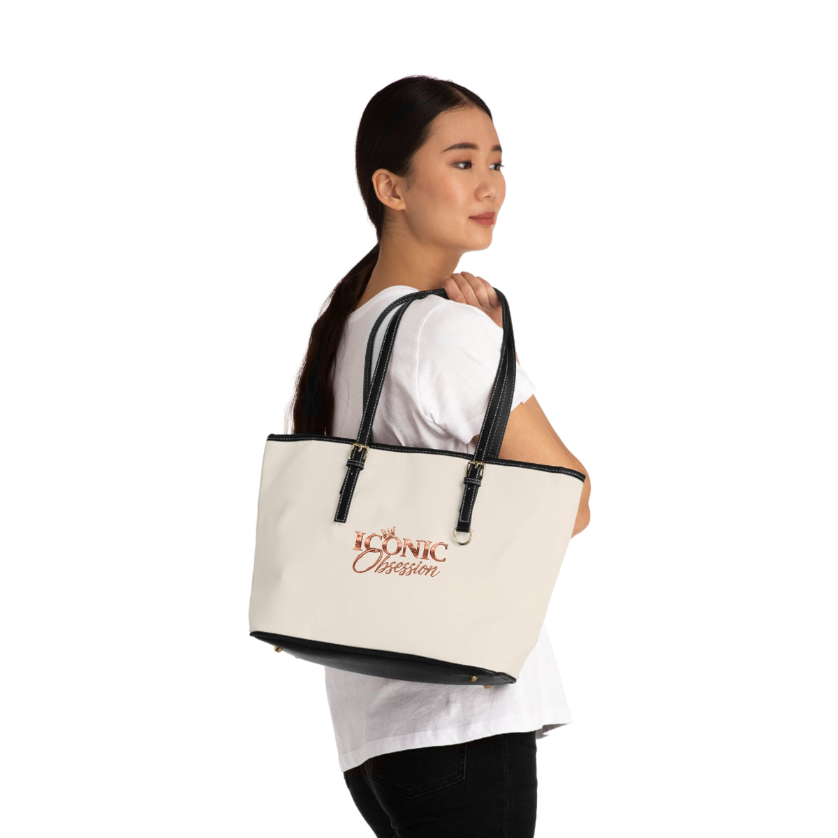 Model carrying the ICONIC Obsession Signature Tote in ivory on the shoulder