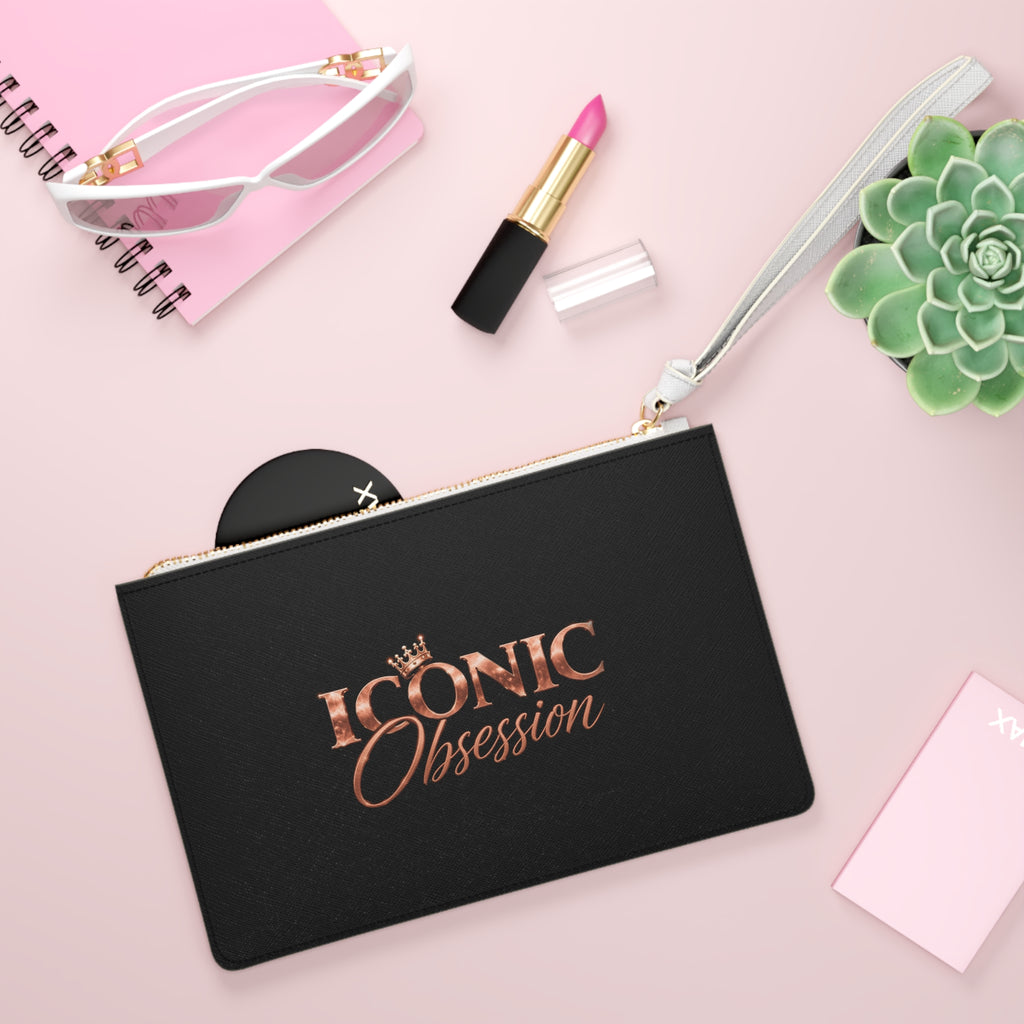 ICONIC Obsession Signature Clutch, styled flat lay with sunglasses and lipstick