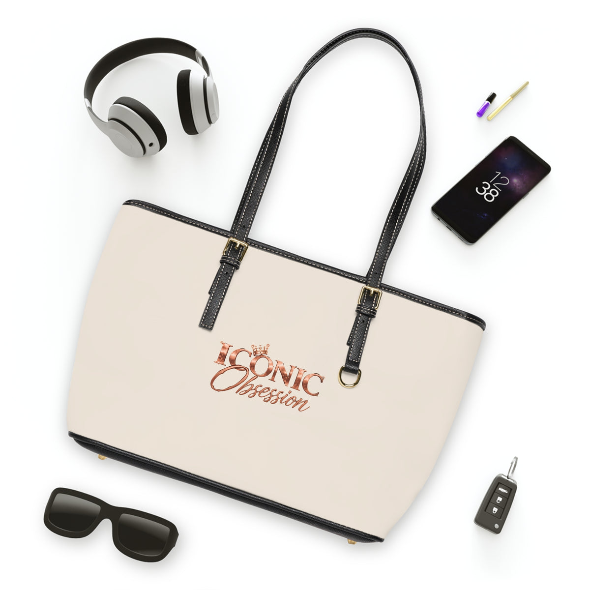 ICONIC Obsession Signature Tote in ivory, styled flat lay with sunglasses and headphones
