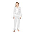 Model in the ICON Queen white satin pajama set with black piping and the rose-gold ICON Queen logo on the pocket