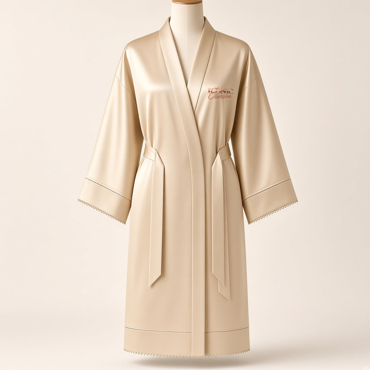ICONIC Obsession Satin Robe in champagne, front view with rose-gold logo on the chest
