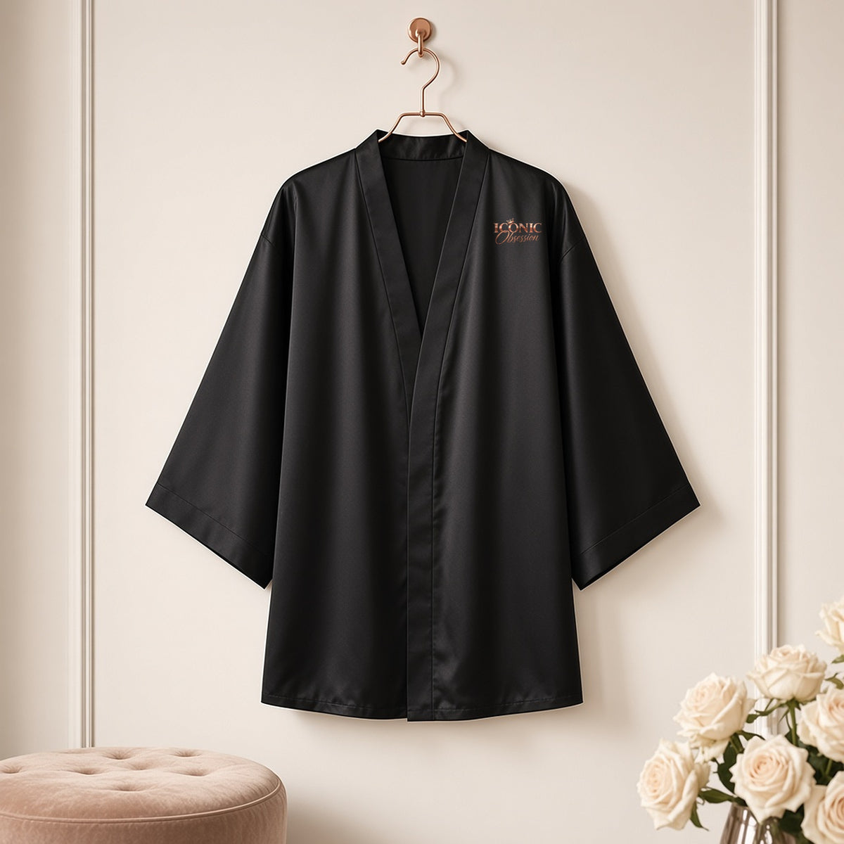 ICONIC Obsession black silky kimono robe on a rose-gold hanger, rose-gold crown logo on the chest